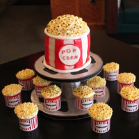 Popcorn Cake & Cupcakes A Popcorn Cake and Cupcakes. I made this for a 7 year olds movie theater birthday party. I used different ideas from cakes I saw on here....