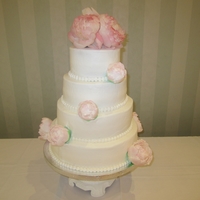 Peony Wedding Cake 4 tiers, buttercream frosted. Handmade fondant peonys and fresh flower topper