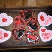 Valentine Cookies This was the first time I had ever really decorated a cookie. I made chocolate roll-out cookies and covered them in a poured chocolate-...