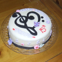15Th Bday Trebel Heart Cake 10" Round Cake, covered with rolled Fondant, true black mmf trebel heart, gumpaste butterflies and flowers. Buttercream frosting,...