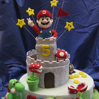 Mario Bros For Andrew Mario Bro cake, top castle made from cereal rice.