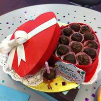 Seasonal Cakes Red velvet cake covered in fondant made to look like box of chocolate truffles. The "lid" and box are the cakes and the "...
