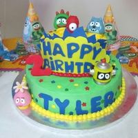 Yo Gabba Gabba 2 tier (8" and 10") Yellow cake with BC and pineapple filling.