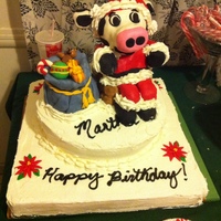 Santa Cow This was a very large half sheet cake. The cow is made of rice krispies with MMF. Inside was chocolate cake with raspberry filling and...