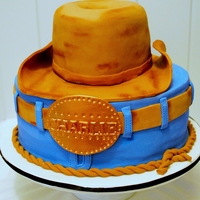 Charlies Cowboy Cake 10" Round White chocolate cake with chocolate ganacheHat was carved from a 6" Round Chocolate cake with chocolate ganache. Belt...