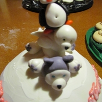 Igloo With Husky, Penguin, And Seal Igloo cake with Husky, Seal, and Pengiun.