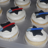 1317012472.jpg Star Wars Cupcakes. Frosted with VMBC and embellished with MM fondant.