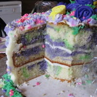 Buterflies And Flowers Rainbow Vanilla purple and green marble cake covered with Buttercream icing and fondant accents