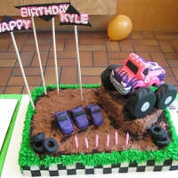Monster Truck Twin Cakes Vanilla cake with vanilla buttercream, topped with chocolate butter cream and oreo cookie crumbs. Trucks, tires and ramps are all Rice...