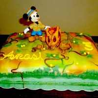 Mickey Mouse Cake. Micky and the dinosaur. Airbrushed cake.