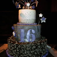 Sweet 16 3 Tier cake ( 2 tiers are dummies) covered in Black, Marbled and White Fondant with Royal Icing decoration