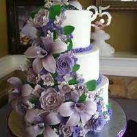 Orchid And Rose Cascade All gum paste flowers on buttercream cake.