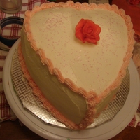 Heart Shaped Valentine Cake strawberry swirl cake with buttercream frosting.