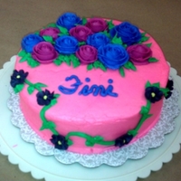 Wilton Basic Course Final Cake Yellow cake with bc. Roses, drop flowers.