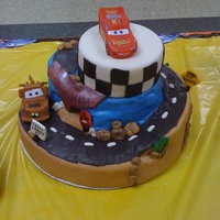 Cars Themed Baby Shower Cake Fondant covered, carved Cars themed baby shower cake.