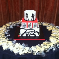 Poker/james Bond Themed Cake A mmf decorated cake. I cut the silhouettes out of mmf. The playing cards are sugar sheets.
