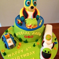 Agent Oso Birthday Cake Agent Oso and 3D characters are made of rice crispy treats and covered in Fondant.
