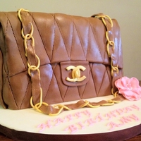 Chanel Purse Cake Chanel Purse cake.It is completely edible. Covered in all fondant.