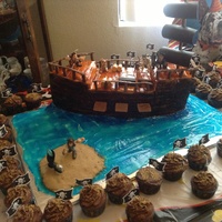 Pirate Ship Cake Pirate ship cake with cupcakes.