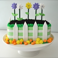 Garden Cake I made this for my mother-in-law's birthday this year. It was inspired by a cake I found on Cake Central. Carved chocolate cake filled...