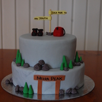 Peters 50Th Birthday Cake 2 Tier choc mudcake covered in fondant. All decorations handmade & edible. Made for a man turning 50. He loves moubtain climbing and...