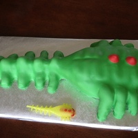 Lego Hero Factory Brain Bug Body is cake, and legs and tail are rice crispy treats. All covered in fondant. The toy on the side is the model.