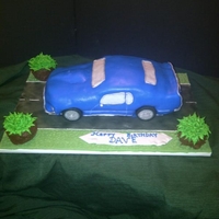 69 Mustang Mach 1 My first car cake. Lots of detail but worth the effort. Fondant strips around the windows and trim then painted with silver pearl dust....