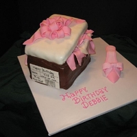 Shoe Box Cake With Pink High Heel A pink high heel shoe with embossed ribbon next to a chocolate fondant covered shoe box. The lid is a 1" cake tilted with gum paste...