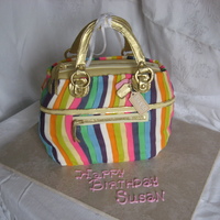 Purse Cake A replica of a Coach purse. 9 colors of fondant in 1/2" strips. Thank you to Craftsy for the classes for help in learning different...