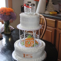 Gerber Daiseys This was a 15th anniversary cake. She wanted Gerber Daiseys on the cake but had a special topper that meant something to the couple because...