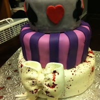 Evil Alice My Birthday Cake to myself! :DAll from scratch.Chocolate Cake for the 1st and 3rd tier, Red Velvet cake for the middle tier.Marshmallow...