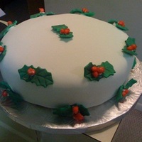 Holly Christmas My Christmas present to my Mom.All from scratch.White Cake.Buttercream frosting, Marshmallow Fondant.The Holly leaves are also made of...