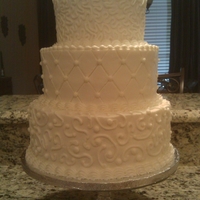 Three Tier With Scrolls All three tiers were white cake with white buttercream.