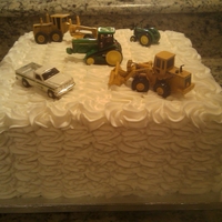 Love Of Tractors This cake was actually for the groom for the rehearsal dinner. White cake with white buttercream.