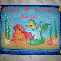 Ariel And Flounder Birthday Cake Chocolate cake with vanilla buttercream. Ariel, Flounder, and seaweed are fondant, shells and seahorses are chocolate.