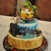 Hunting Cake This incorporated the birthday boy's loves: hunting elk, mallards and fishing.