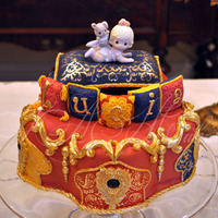 Moroccan Baby Shower Cake Precious Moment statue is not edible.