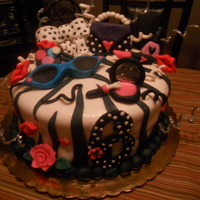 ***makeup Galore*** This cake did not cooperate!! Especially the fondant!!! Pettinice was too soft to handle on this big cake!! I am still learning...I was...