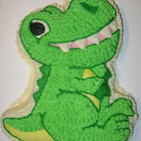 Dinosaur Cake Dinosaur cake using Wilton's dinosaur pan. Carrot cake with crusting cream cheese icing.