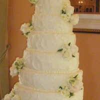 Stucco Cake White chocolate buttercream with real flowers.