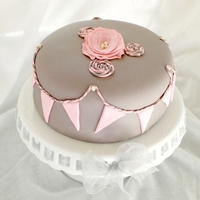 Fondant Flag Bunting And Baker's Twine Rosette Cake A soft grey and pink cake inspired by obsessions with bakers' twine, flag bunting, pearls, and fabric rosettes.