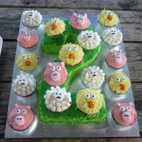 Farmyard Birthday Cake Farmyard cupcakes atop a number two cake.