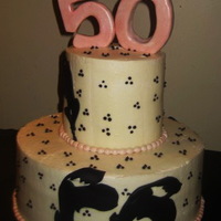 50Th Birthday- Cake Matches Invitation two tier chocolate cake with buttercream. Pink pearls are fondant, #50 is rice krispy treats covered in fondant. Large black flower cut-...