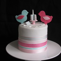2 Little Birdies! 2 Little Babies! This is a cake for 2 little babies - 1 boy, 1 girl for their joint 1st birthday party! Layered with white chocolate ganache. 7 inches in...