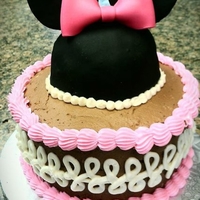 Minnie Mouse Ears And Bow Cake Fondant bow with rice treat Minnie Mouse ears on top of buttercream cake