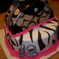 Coach Purse Cake Fondant and buttercream Coach purse cake. The 'C's' are painted on.