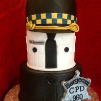 Police / Sergeant Promotion Cake Top hat is made of cake and carved to resemble sergeant hat for the Chicago police dept. White collared shirt had sergeant insignia on...