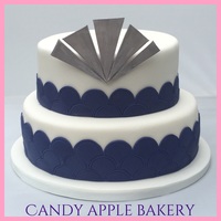 20's Themed Wedding Cake 20's themed wedding cake in navy and silver, hand cut scallopes and topper.From Candy Apple Bakery