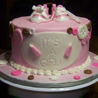 Baby Shower Cake Done For My Daughters Co Worker Swiss Meringue Buttercream Filling And Icing Fondant Converse And Buttons Baby shower cake done for my daughter's co-worker. Swiss meringue buttercream filling and icing. Fondant converse and buttons!!