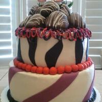 42 Birthday Cake Cake I made for a good friend with butter cream icing, chocolate cake, chocolate dipped strawberries & fondant decoration.